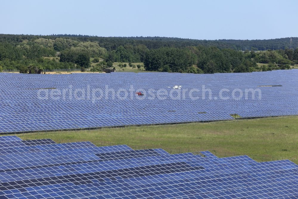 Werneuchen from above - Panel rows of photovoltaic and solar farm or solar power plant in Werneuchen in the state Brandenburg