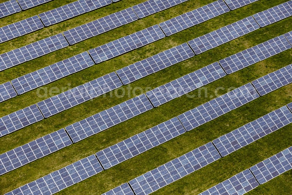 Aerial photograph Werneuchen - Panel rows of photovoltaic and solar farm or solar power plant in Werneuchen in the state Brandenburg