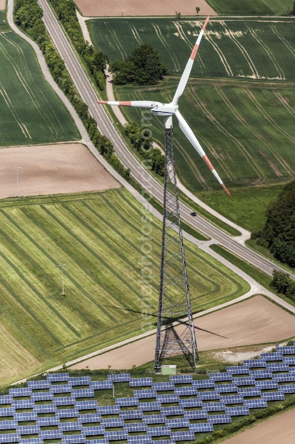 Feuchtwangen from above - Panel rows of photovoltaic and solar farm or solar power plant and wind turbine in Feuchtwangen in the state Bavaria, Germany