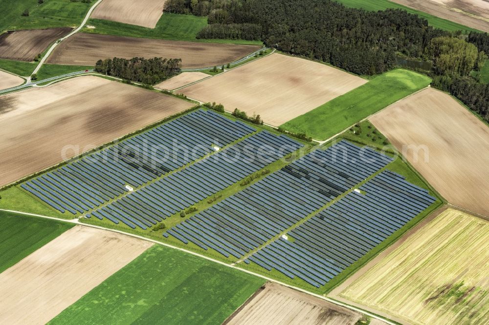 Aerial image Wolframs-Eschenbach - Panel rows of photovoltaic and solar farm or solar power plant in Wolframs-Eschenbach in the state Bavaria, Germany