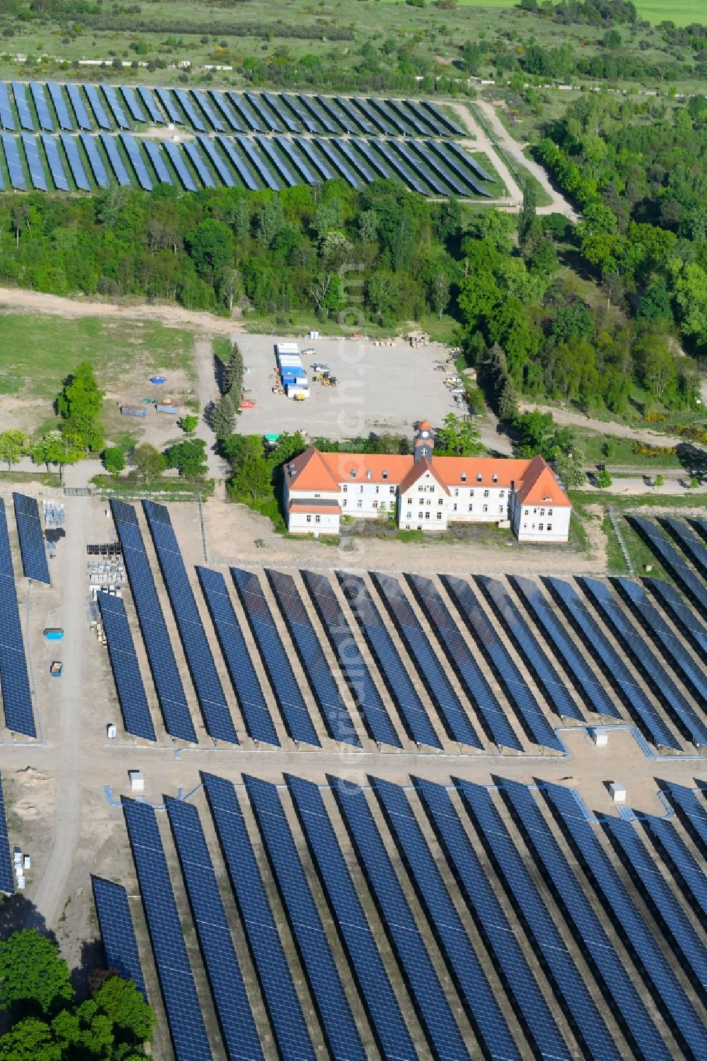 Aerial image Zeithain - Panel rows of photovoltaic and solar farm or solar power plant in Zeithain in the state Saxony, Germany