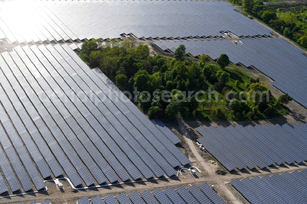 Zeithain from the bird's eye view: Panel rows of photovoltaic and solar farm or solar power plant in Zeithain in the state Saxony, Germany