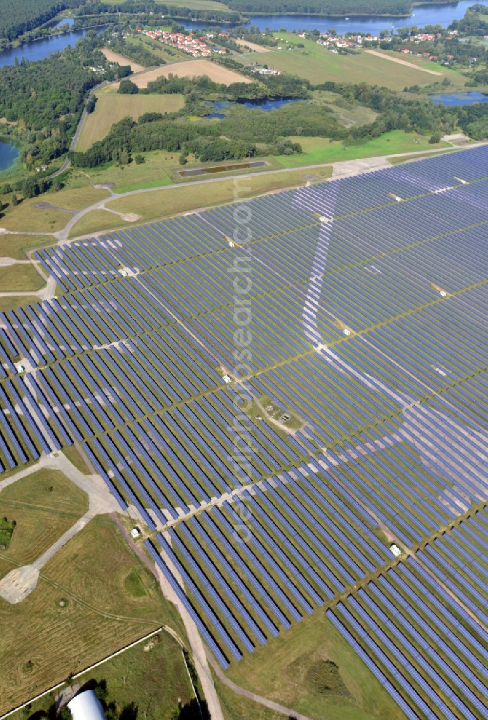 Aerial photograph Brandenburg an der Havel - View on the largest solar Park in Europe on the former NVA airfield Brandenburg-Briest in Brandenburg an der Havel in the Federal State of Brandenburg. It is a joint project between the company of Q-cells and the investors Luxcara GmbH and the MCG group