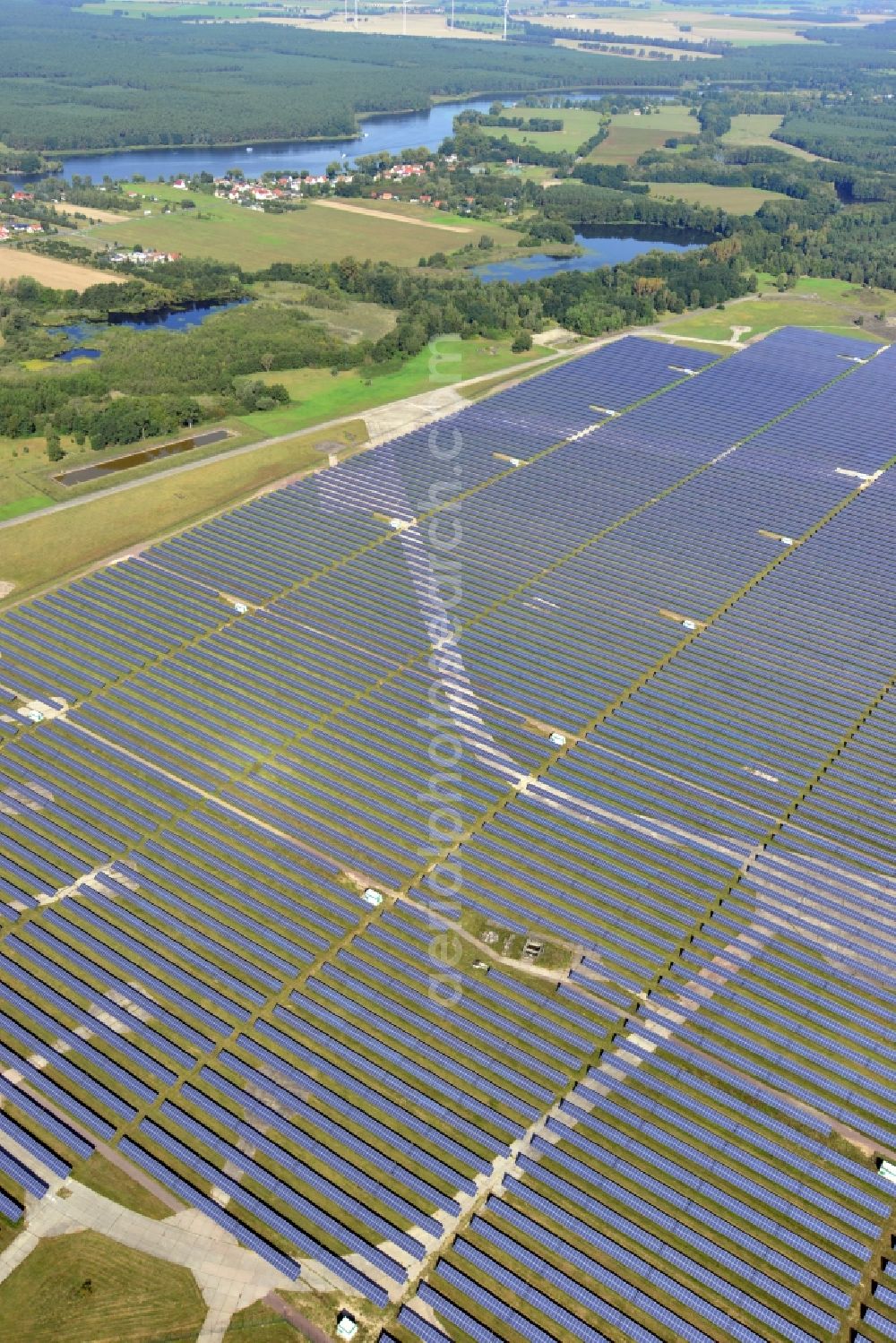 Aerial photograph Brandenburg an der Havel - View on the largest solar Park in Europe on the former NVA airfield Brandenburg-Briest in Brandenburg an der Havel in the Federal State of Brandenburg. It is a joint project between the company of Q-cells and the investors Luxcara GmbH and the MCG group