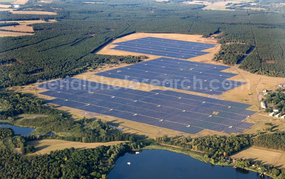 Aerial photograph Brandenburg an der Havel - Panoramic view on the largest solar Park in Europe on the former NVA airfield Brandenburg-Briest in Brandenburg an der Havel in the Federal State of Brandenburg. It is a joint project between the company of Q-cells and the investors Luxcara GmbH and the MCG group