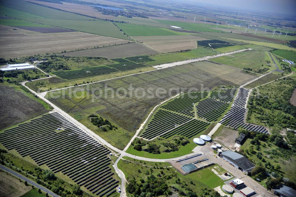 Aerial image Köthen - Blick auf den Solarpark auf dem Flugplatz Köthen. Auf einer Fläche von 55 Hektar ist es das bundesweit zweitgrößte Photovoltaik-Kraftwerk und wurde 2008 in Betrieb genommen. Die hochmoderne PV-Anlage besteht aus ca. 200.000 dünnschicht Solarmodulen der Firma First Solar. Betrieben wird das Feld von der juwi solar GmbH. Solar Park at the former airfield Köthen.