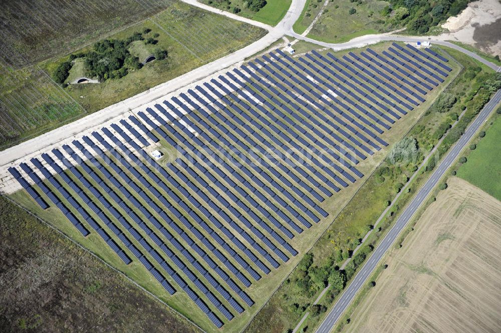 Aerial image Köthen - Blick auf den Solarpark auf dem Flugplatz Köthen. Auf einer Fläche von 55 Hektar ist es das bundesweit zweitgrößte Photovoltaik-Kraftwerk und wurde 2008 in Betrieb genommen. Die hochmoderne PV-Anlage besteht aus ca. 200.000 dünnschicht Solarmodulen der Firma First Solar. Betrieben wird das Feld von der juwi solar GmbH. Solar Park at the former airfield Köthen.