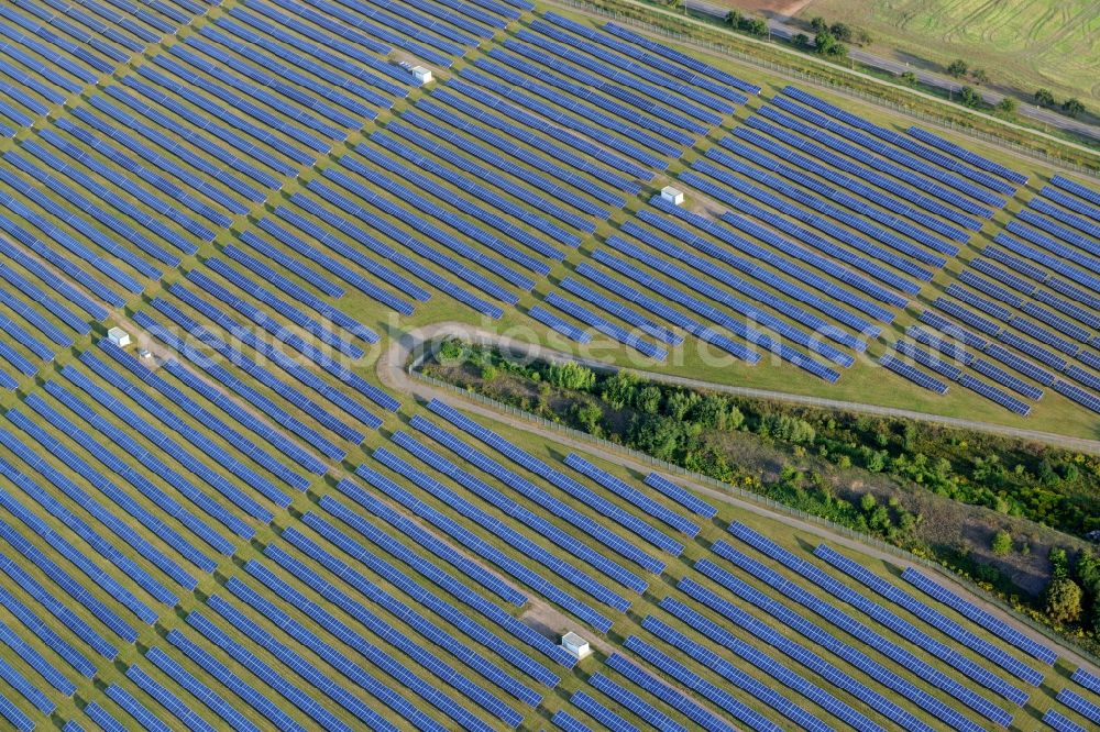 Helbra from the bird's eye view: Panel rows of photovoltaic and solar farm in the East of Helbra in the state of Saxony-Anhalt