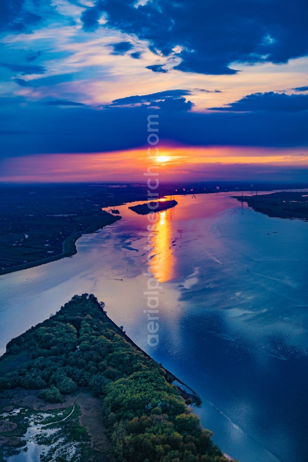 Lühesand from above - Sunset over the countryside and Elbe river in Luehesand in the state Lower Saxony, Germany