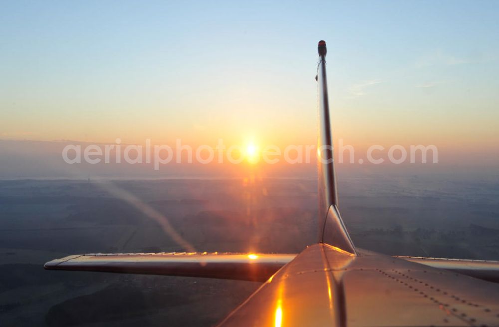 Heiligenfeld from the bird's eye view: Blick aus einer Cessna 172 der Agentur euroluftbild.de D-EGYC auf den Sonnenaufgang bei Heiligenfelde in Sachsen-Anhalt. View out of a Cessna 172 at the sunrise near by Heiligenfelde in Saxony Anhalt.