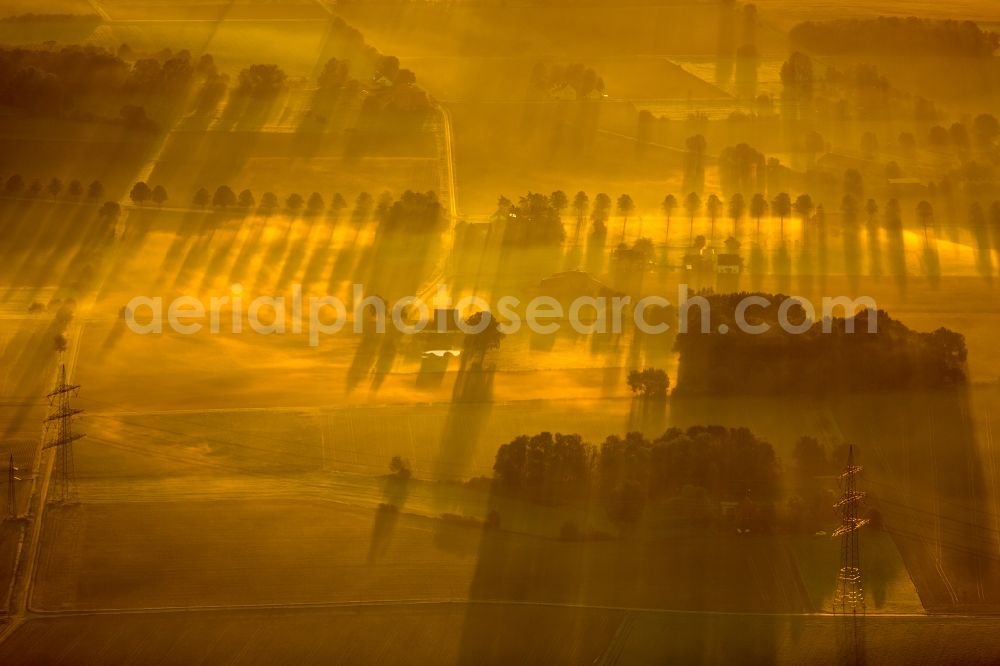 Hamm from the bird's eye view: Sunrise over the scenery of the eastern edge of town with farms and farming communities in Hamm in North Rhine-Westphalia