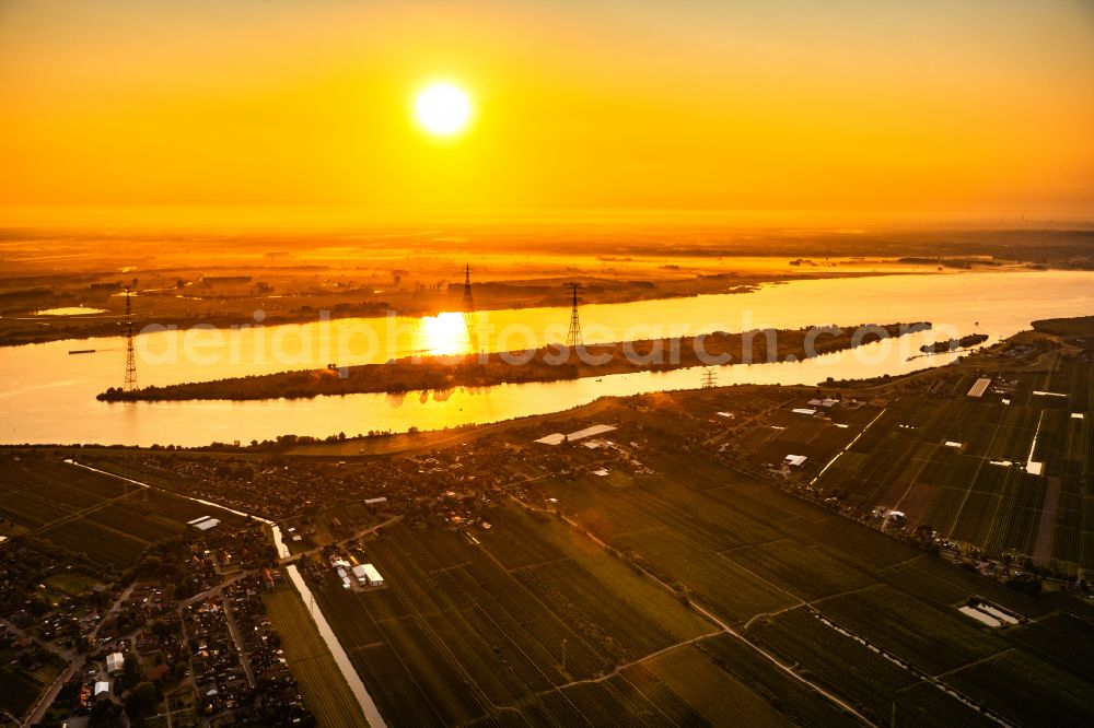 Aerial photograph Steinkirchen - Sunrise over the Elbe island Luehesand in Steinkirchen in the state Lower Saxony, Germany