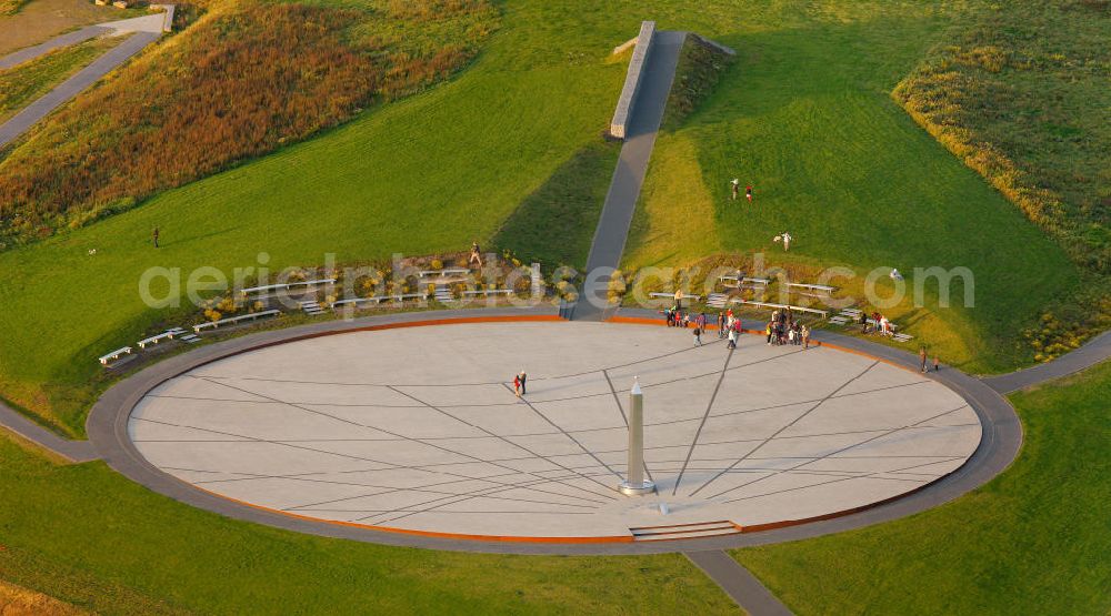 Aerial photograph RECKLINGHAUSEN - View of Halde Hoheward with its solar clock between the cities of Recklinghausen and Herten in Nort Rhine-Westphalia. The solar clock, with its obelisk serving as a pointer, is part of the horizon oberservatory. Together with the Halde Hoppenbruch, Halde Hoheward forms the landscape park Hoheward ( formerly Emscherbruch )