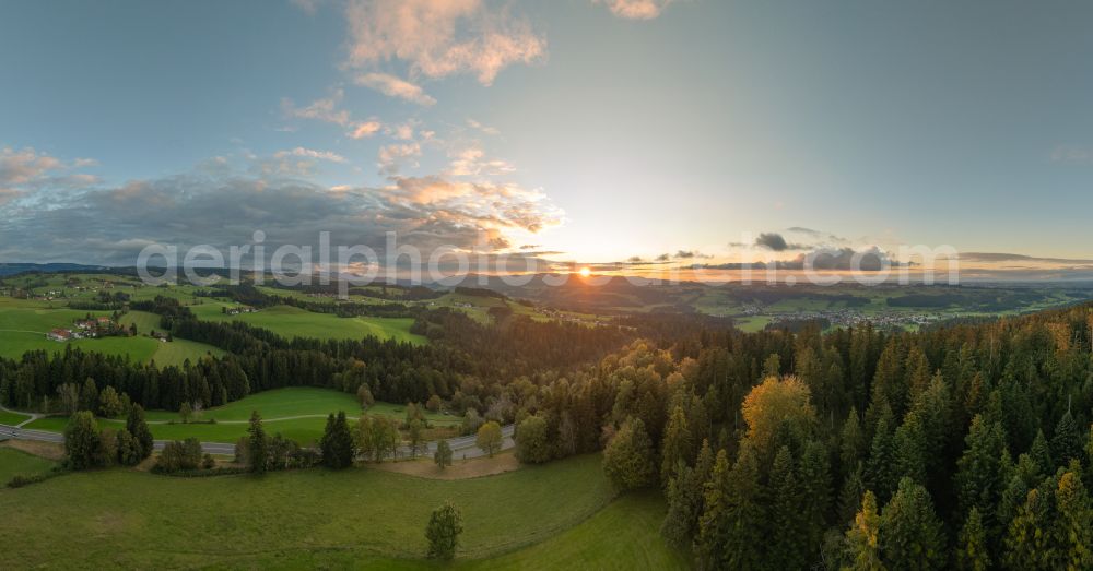 Aerial image Langenried - Weather-related cloud layer over forest and meadow landscape at sunset in Langenried im Allgaeu in the federal state of Bavaria, Germany