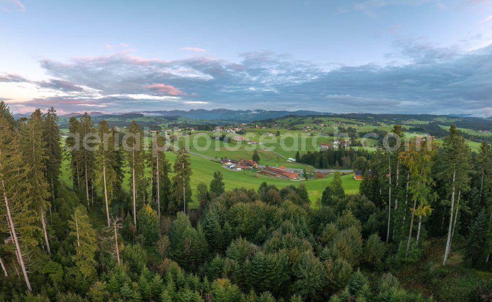 Aerial photograph Langenried - Weather-related cloud layer over forest and meadow landscape at sunset in Langenried im Allgaeu in the federal state of Bavaria, Germany