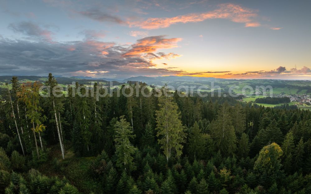 Langenried from the bird's eye view: Weather-related cloud layer over forest and meadow landscape at sunset in Langenried im Allgaeu in the federal state of Bavaria, Germany