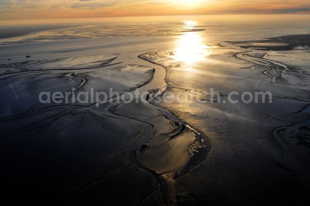 Emden from above - North Sea coastal landscape with sunset at low tide on the Wadden Sea on the Ems estuary, near Emden in Lower Saxony