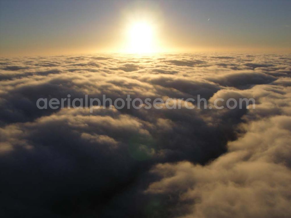 Brand from the bird's eye view: 14.11.2004 Sonnenuntergang über den Wolken bei Brand / Brandenburg