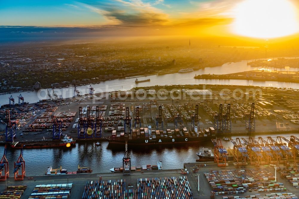 Hamburg from the bird's eye view: Sunset on Container Terminal in the port of the international port of the EUROGATE Container Terminal Hamburg GmbH in Hamburg