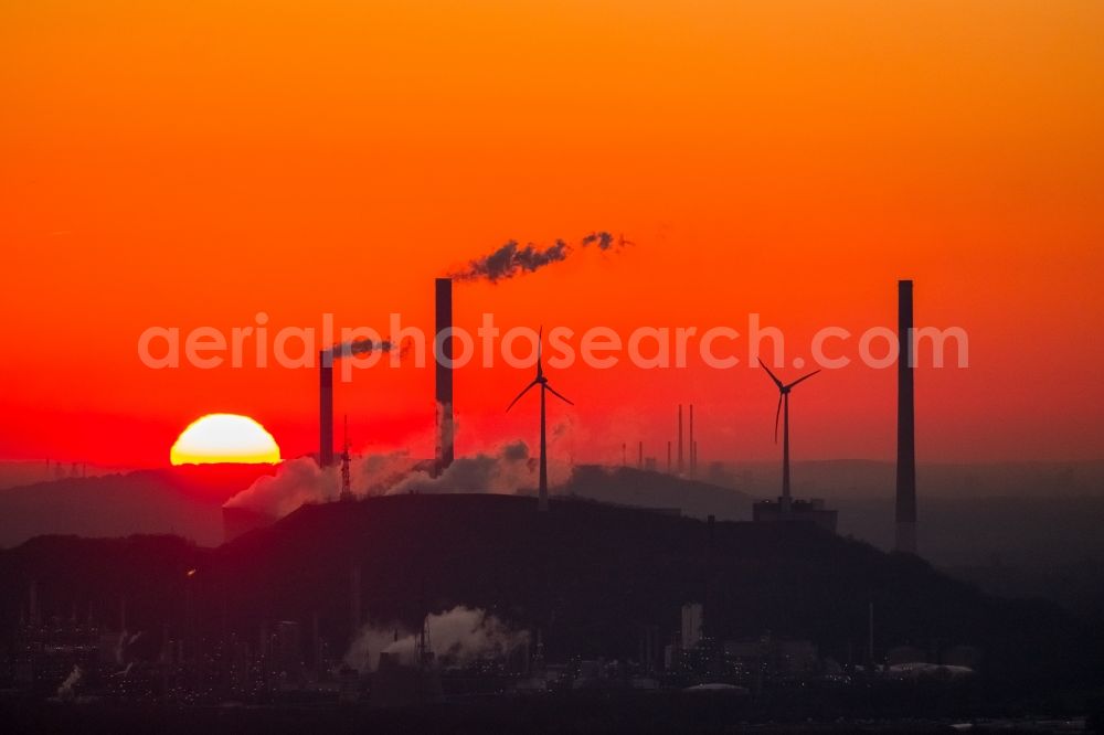 Aerial photograph Gelsenkirchen - Smoke and silhouette of the sun Set power plant Scholven in Gelsenkirchen in the state of North Rhine-Westphalia