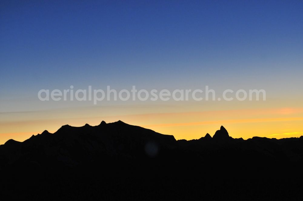 Aerial photograph Wallis - Sunset with silhouette of mountain - summit of Mont Blanc, the highest mountain in the mountains of the Alps in the triangle in Valais in Switzerland