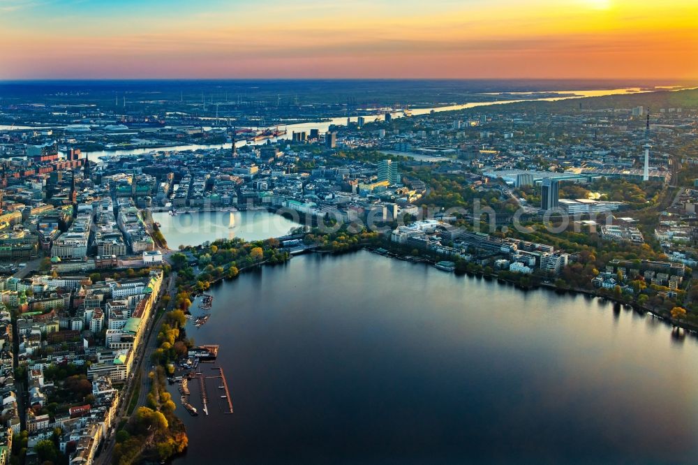 Aerial image Hamburg - Golden yellow colored horizon at sunset over the bank areas at the lake area of the aussenalster in the city center in Hamburg