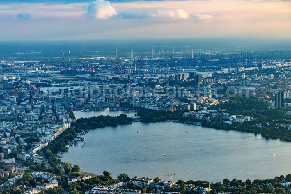 Hamburg from above - Golden yellow colored horizon at sunset over the bank areas at the lake area of the aussenalster in the city center in Hamburg