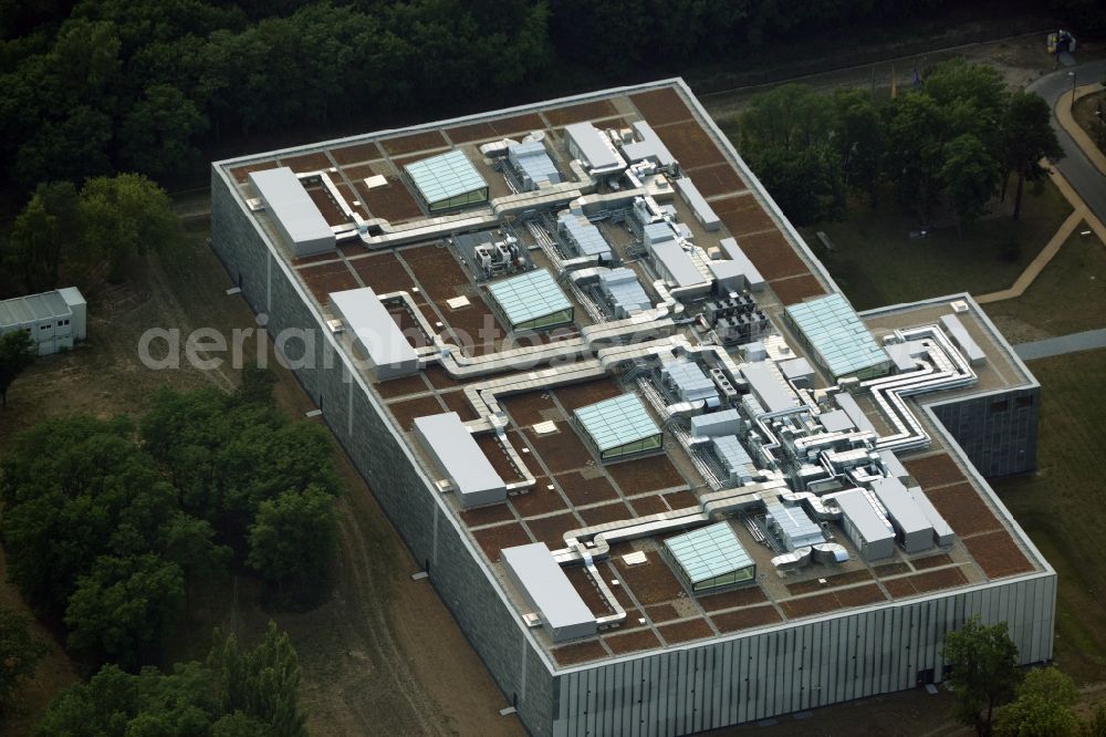 Aerial image Berlin - Storage facilities on Fuerstenwalder Damm in the district of Treptow-Koepenick in Berlin in Germany. The magazine with its distinct architecture, facade and technical facilities on the roof was designed by architect Eberhard Wimmer. It is home to archives, depots and inventories of the State Library Berlin, the Ibero-American Institute and the image agency bpk