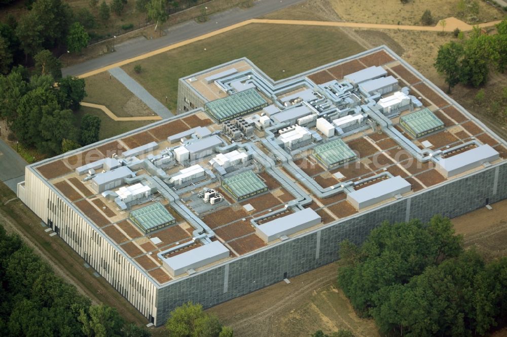 Berlin from the bird's eye view: Storage facilities on Fuerstenwalder Damm in the district of Treptow-Koepenick in Berlin in Germany. The magazine with its distinct architecture, facade and technical facilities on the roof was designed by architect Eberhard Wimmer. It is home to archives, depots and inventories of the State Library Berlin, the Ibero-American Institute and the image agency bpk