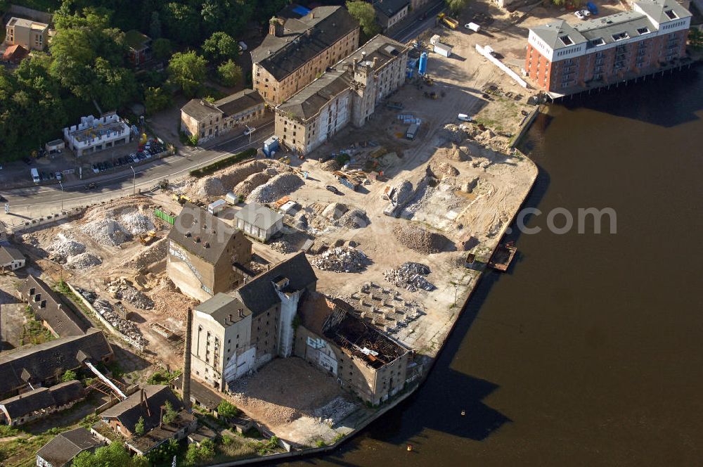 Aerial photograph 04.06.2010 - Blick auf die Speicherstadt in Potsdam-Templiner Vorstadt. Die Speicherstadt ist ein stillgelegtes Gewerbegebiet, das zu DDR-Zeiten als Schlachthof und Mühle mit Speichergebäuden genutzt wurde und in Zukunft einer Mischung aus Dienstleistungen, Wissenschaft, Gewerbe, Wohnungen und Kongresshotel umfassen soll. Look at the warehouse district in Potsdam-Templiner Vorstadt. The warehouse district is an abandoned industrial estate which should include in the future a mix of services, science, commerce, housing and convention hotel.