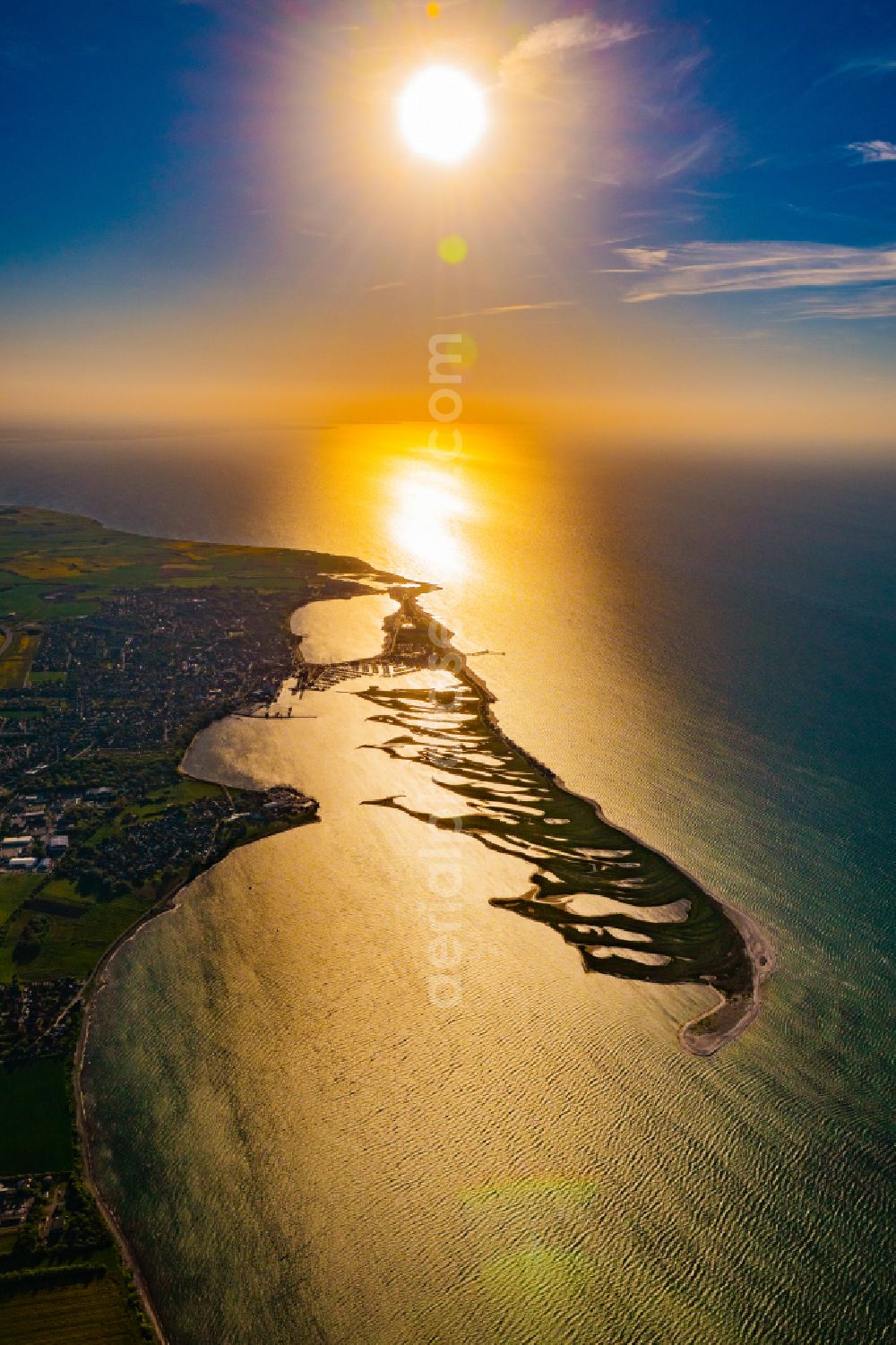 Großenbrode from the bird's eye view: Reflection and sun rays reflection on the water - surface in Grossenbrode on the Baltic Sea coast in the state Schleswig-Holstein, Germany