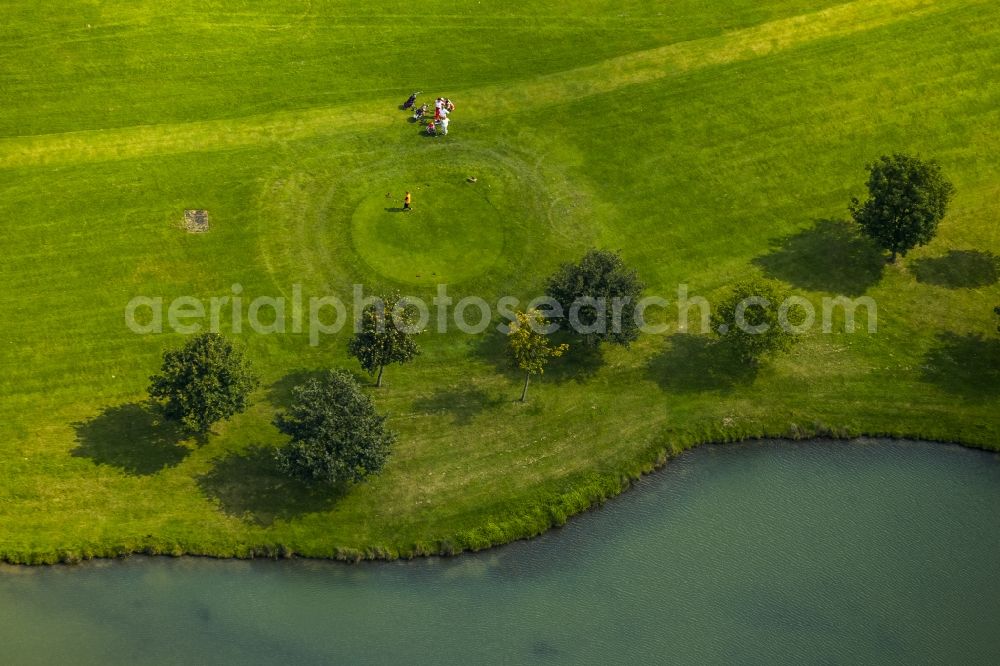 Kamp-Lintfort from above - Playing golfer on a water hazard on the golf course of the Golfclub Am Kloster Kamp e.V. in Kamp-Lintfort in the state North Rhine-Westphalia