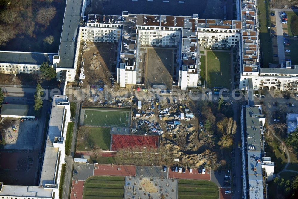 Berlin from above - Playground on the Square of the US-Berlin-Brigade in the Lichterfelde part of Berlin. The playground with its different areas and trees is located in a residential area in the South of Lichterfelde. The trees - like the whole compound - is characterised by its symmetry and geometry