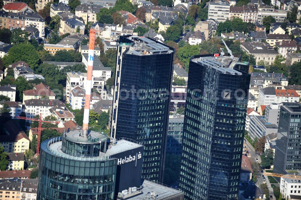 Frankfurt am Main from above - Blick auf die Spitze des Main Tower , dem Hochhaus der HELABA Landesbank Hessen-Thüringen Girozentrale. Im Hintergrund die Hochhaus- Türme der Deutschen Bank. Zum Konzern Hessische Landesbank gehören die Frankfurter Sparkasse, die Tochtergesellschaften, Helaba Invest Kapitalanlagegesellschaft, die Frankfurter Bankgesellschaft und die OFB-Gruppe, die in der Immobilienprojektentwicklung tätig ist. Seit seiner Fertigstellung im Jahr 2000 gehört die Aussichtsplattform des MAIN TOWER zu den meistbesuchten Sehenswürdigkeiten in Frankfurt. View the top of the Main Tower, the skyscraper ofHELABA in Frankfurt.