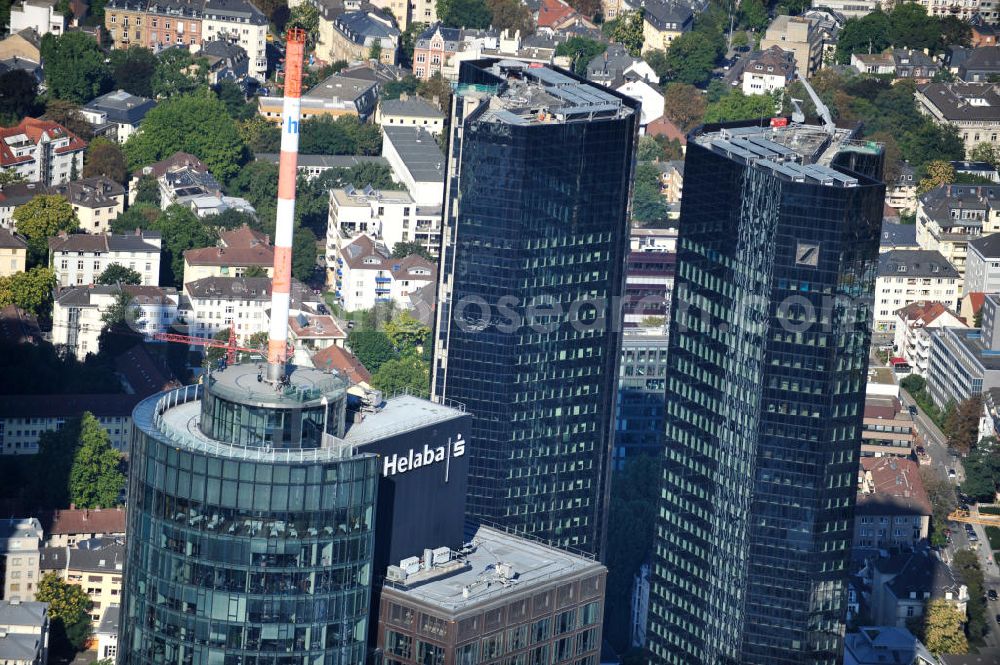 Aerial image Frankfurt am Main - Blick auf die Spitze des Main Tower , dem Hochhaus der HELABA Landesbank Hessen-Thüringen Girozentrale. Im Hintergrund die Hochhaus- Türme der Deutschen Bank. Zum Konzern Hessische Landesbank gehören die Frankfurter Sparkasse, die Tochtergesellschaften, Helaba Invest Kapitalanlagegesellschaft, die Frankfurter Bankgesellschaft und die OFB-Gruppe, die in der Immobilienprojektentwicklung tätig ist. Seit seiner Fertigstellung im Jahr 2000 gehört die Aussichtsplattform des MAIN TOWER zu den meistbesuchten Sehenswürdigkeiten in Frankfurt. View the top of the Main Tower, the skyscraper ofHELABA in Frankfurt.