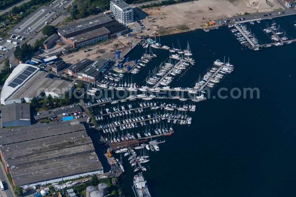 Travemünde from above - Pleasure boat and sailing boat mooring and boat moorings in the harbor on the river bank area of Trave in Travemuende in the state Schleswig-Holstein, Germany