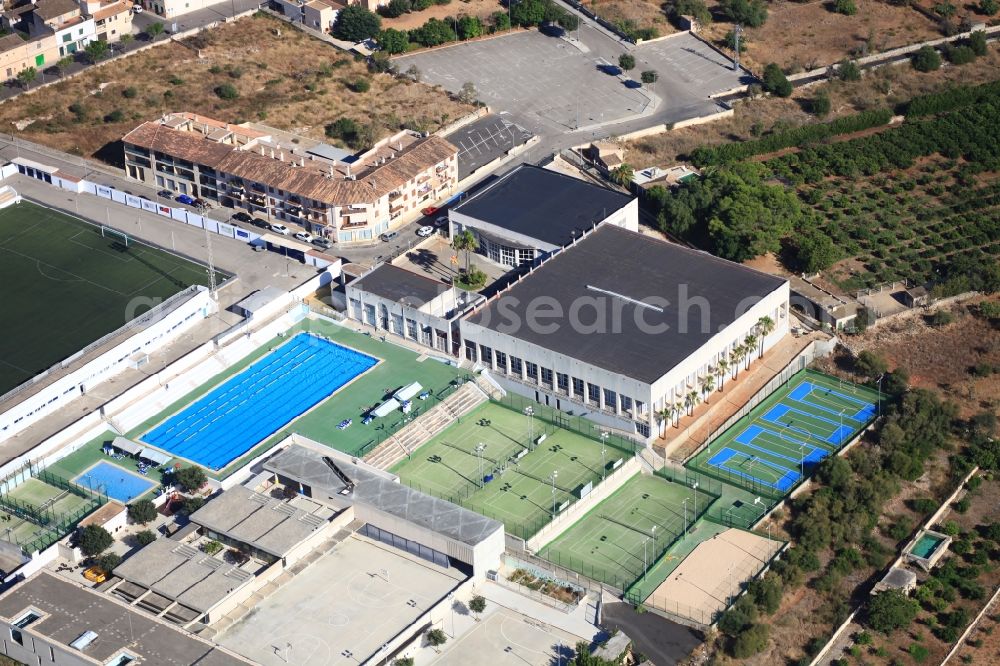 Aerial image Muro - Sports grounds - football pitch, open air swimming pool, tennis court in Muro Mallorca in Balearic Islands, Spain