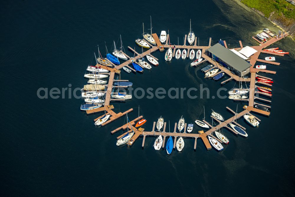 Heimbach from the bird's eye view: Pleasure boat marina with docks and moorings on the shore area Rurtalsperre Schwammenauel on street L15 in the district Hasenfeld in Heimbach in the state North Rhine-Westphalia, Germany