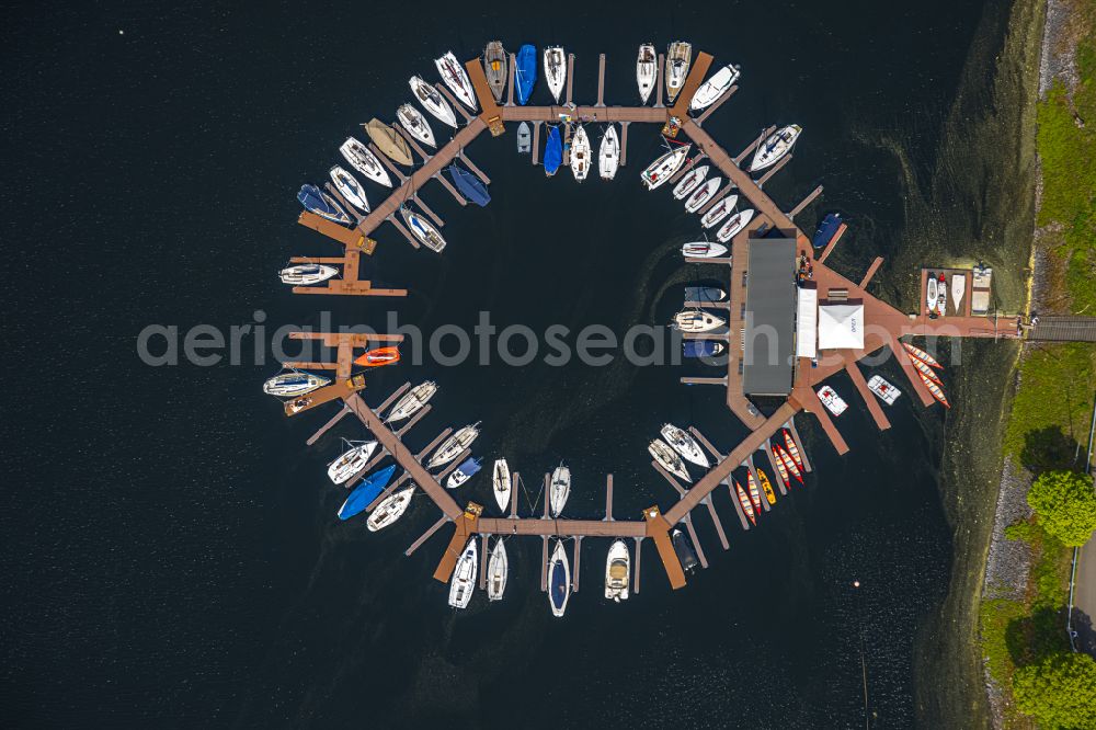 Aerial photograph Heimbach - Pleasure boat marina with docks and moorings on the shore area Rurtalsperre Schwammenauel on street L15 in the district Hasenfeld in Heimbach in the state North Rhine-Westphalia, Germany