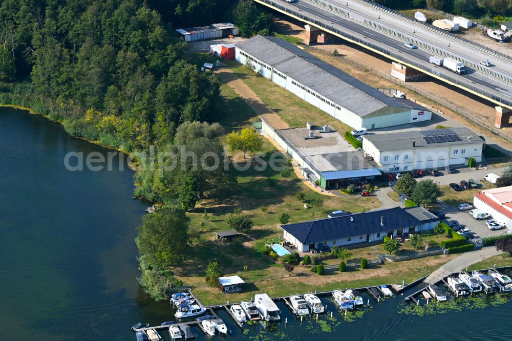 Rüdersdorf from the bird's eye view: Pleasure boat marina with docks and moorings on the shore area Strausberger Muehlenfliess - Hohler See in Ruedersdorf in the state Brandenburg, Germany