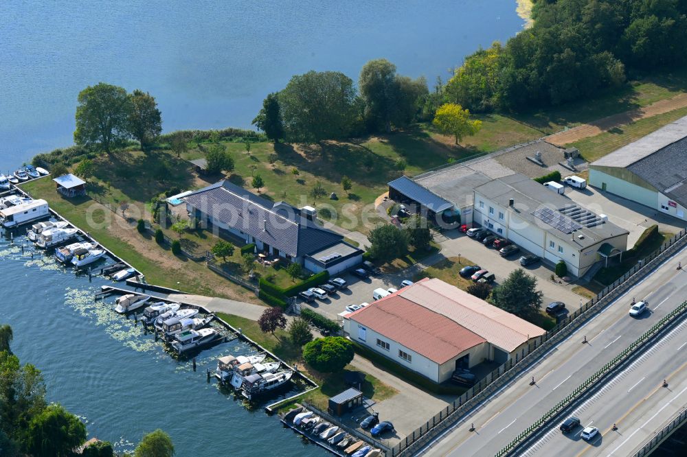 Rüdersdorf from above - Pleasure boat marina with docks and moorings on the shore area Strausberger Muehlenfliess - Hohler See in Ruedersdorf in the state Brandenburg, Germany