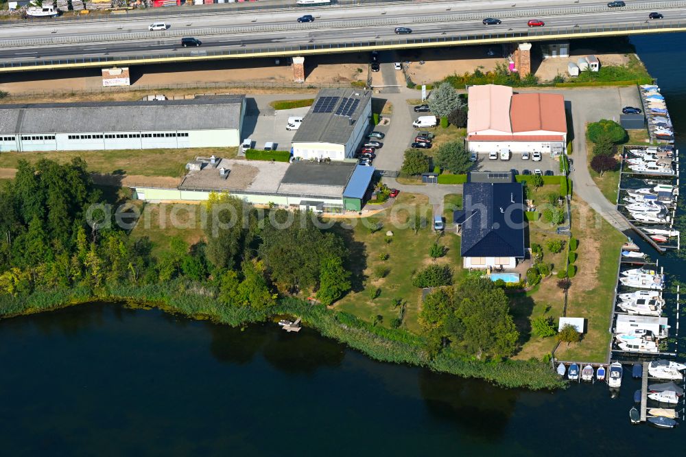 Rüdersdorf from above - Pleasure boat marina with docks and moorings on the shore area Strausberger Muehlenfliess - Hohler See in Ruedersdorf in the state Brandenburg, Germany