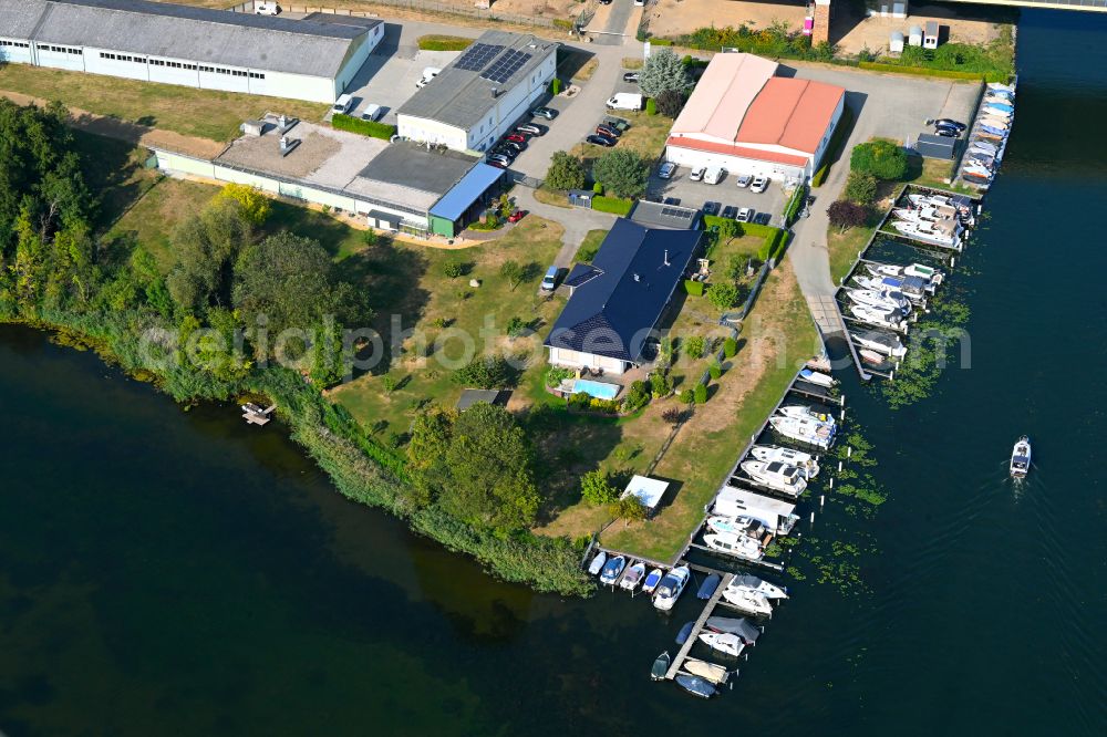 Rüdersdorf from the bird's eye view: Pleasure boat marina with docks and moorings on the shore area Strausberger Muehlenfliess - Hohler See in Ruedersdorf in the state Brandenburg, Germany