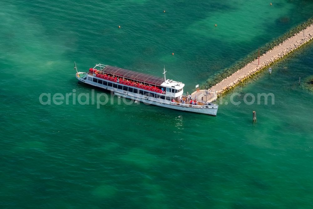 Bardolino from above - Pleasure boat marina with docks and moorings on the shore area in Bardolino in Veneto, Italy