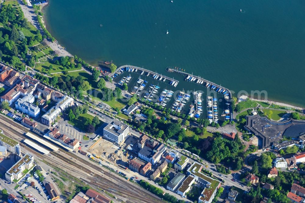 Friedrichshafen from the bird's eye view: Pleasure boat marina with docks and moorings on the shore area on Uferstrasse in Friedrichshafen in the state Baden-Wurttemberg, Germany