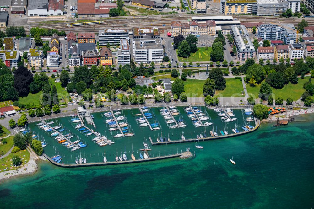 Friedrichshafen from the bird's eye view: Pleasure boat marina with docks and moorings on the shore area on Uferstrasse in Friedrichshafen in the state Baden-Wurttemberg, Germany