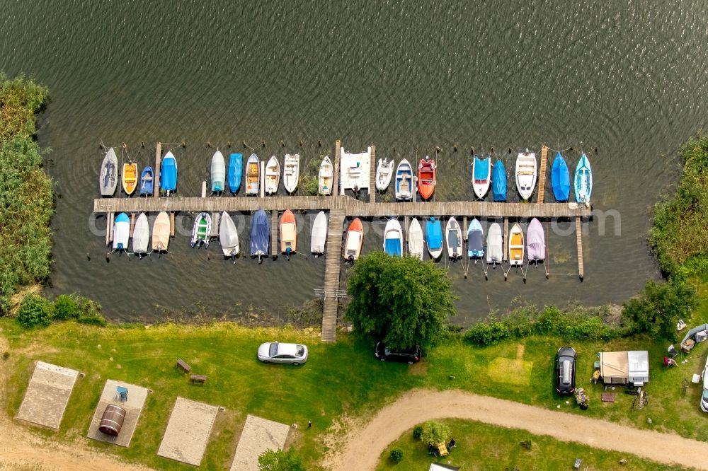 Krakow am See from the bird's eye view: Pleasure boat marina with docks and moorings on the shore area in Krakow am See in the state Mecklenburg - Western Pomerania