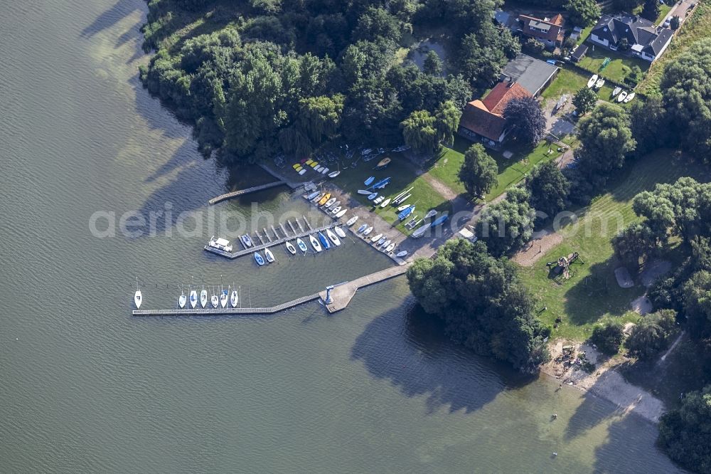 Malente from above - Pleasure boat marina with docks and moorings on the shore area Kellersee in the district Bad Malente-Gremsmuehlen in Malente in the state Schleswig-Holstein