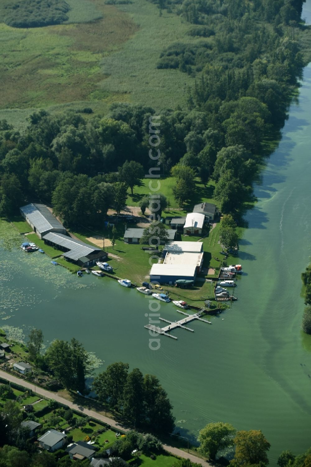 Rathenow from the bird's eye view: Pleasure boat marina with docks and moorings of the Rathenower Wassersportverein Kanu 1922 e.V. on the shore area in Rathenow in the state Brandenburg