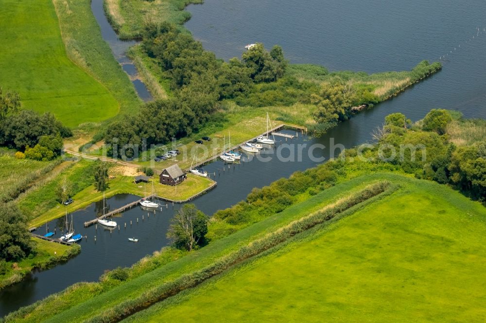 Malchin from the bird's eye view: Pleasure boat marina with docks and moorings on the shore area of the river Westpeene and water mouth at the lake Kummerower See in Malchin in the state Mecklenburg - Western Pomerania